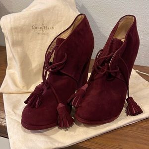 Cole Hahn suede burgundy high heel ankle boots with tassel ties.